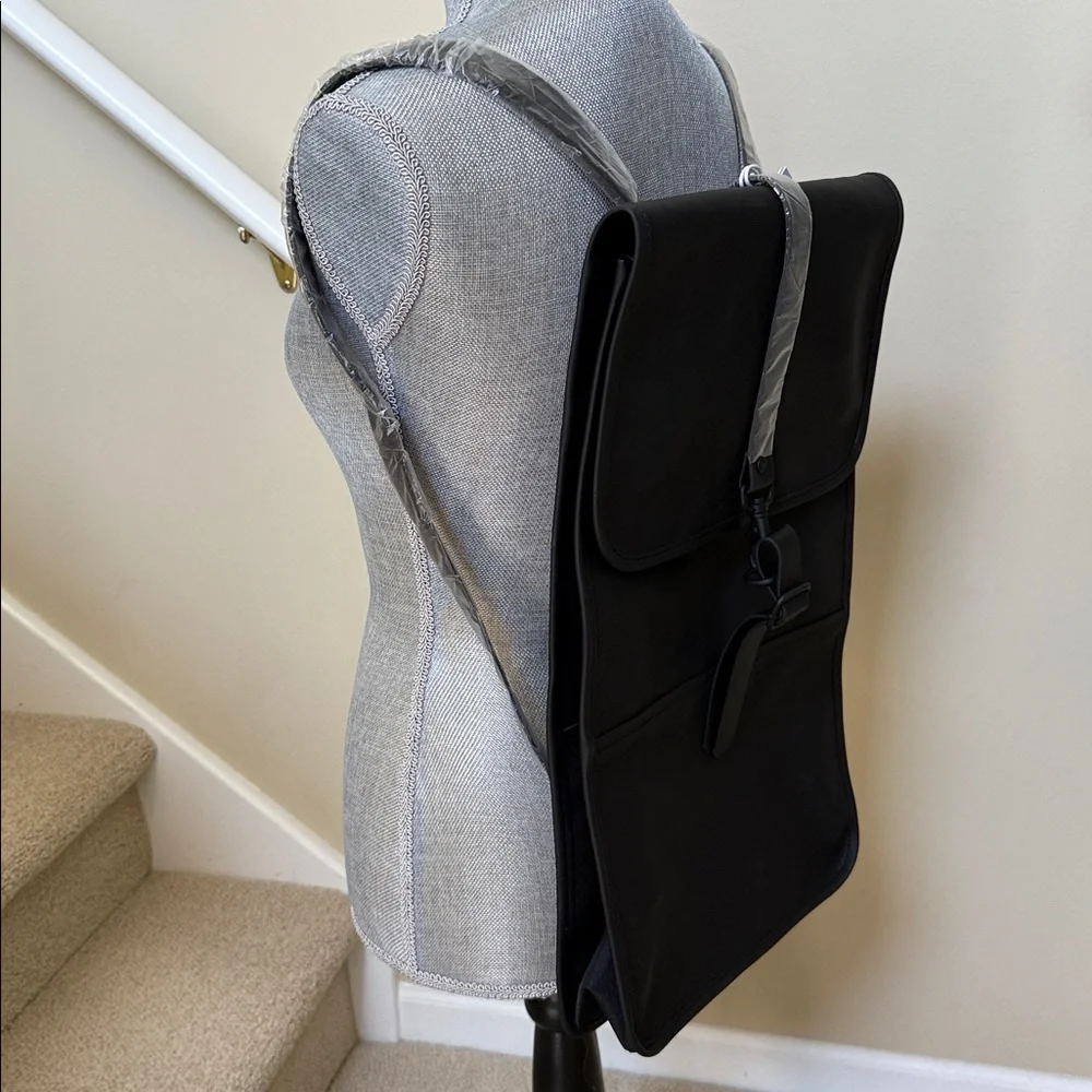 Rains Black Backpack. Clean and ever contemporary.